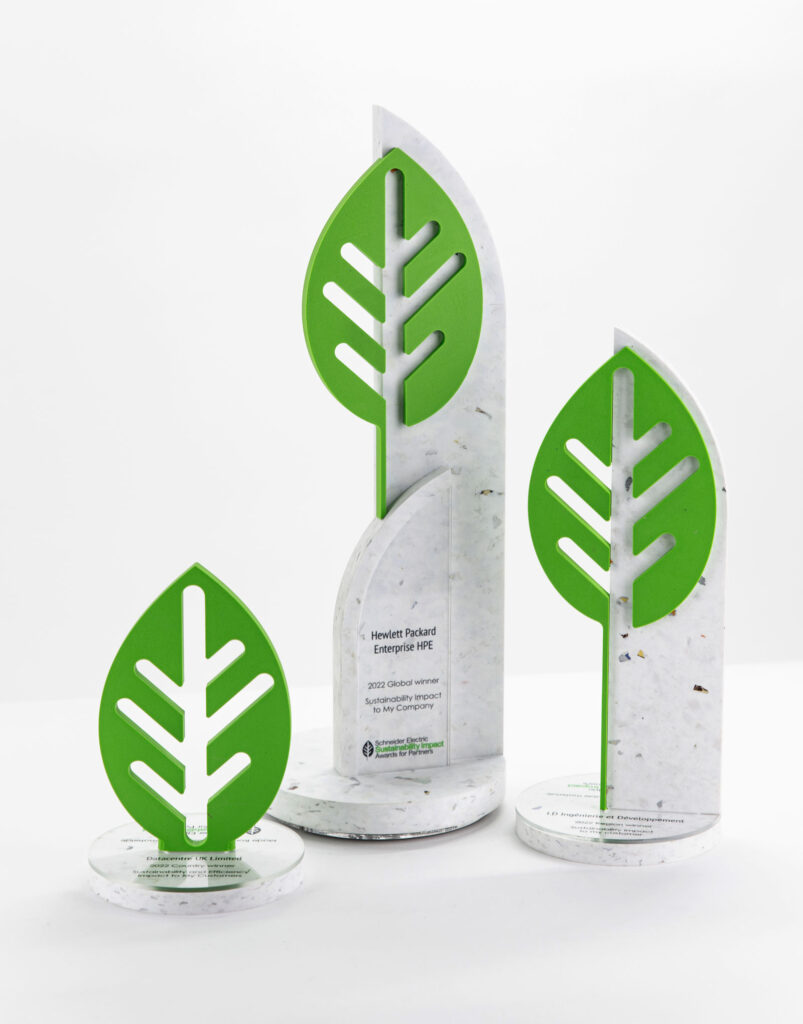 Line up of eco-friendly tophies for the Schneider Impact awards 2023 made from old packaging and recycled acrylic