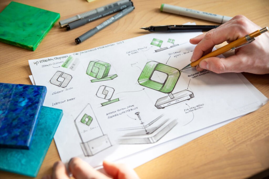 Custom event trophies: The complete guide to designing awards 8 hand shown sketching a colour design of a bespoke trophy