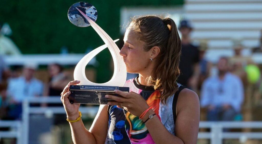 Custom event trophies: The complete guide to designing awards 6 Athlete kasatkina daria holding and kissing tennis trophy