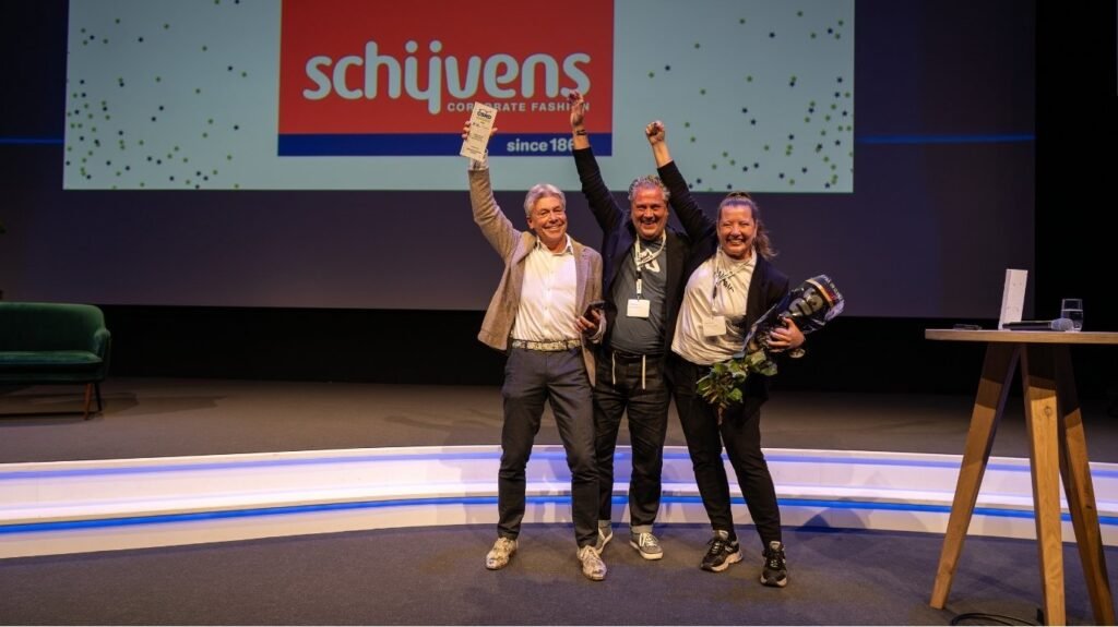 Custom event trophies: The complete guide to designing awards 4 3 team members receiving a trophy at an award event and celebrating with arms in the air