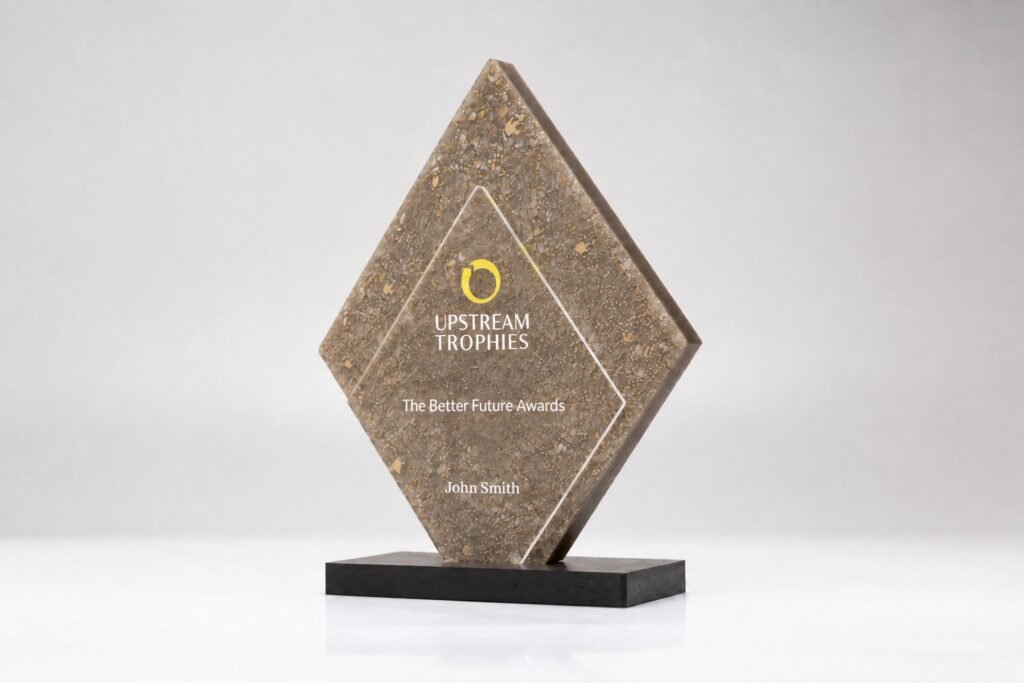 Diamond trophy with Gold Dust centerpiece made from recycled perfume caps on a black base